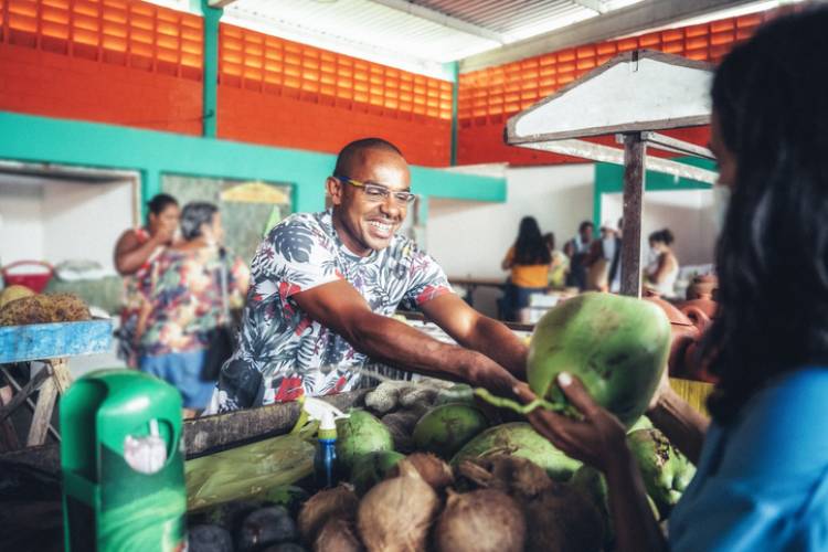 man selling fruit at farmers market sanibel island